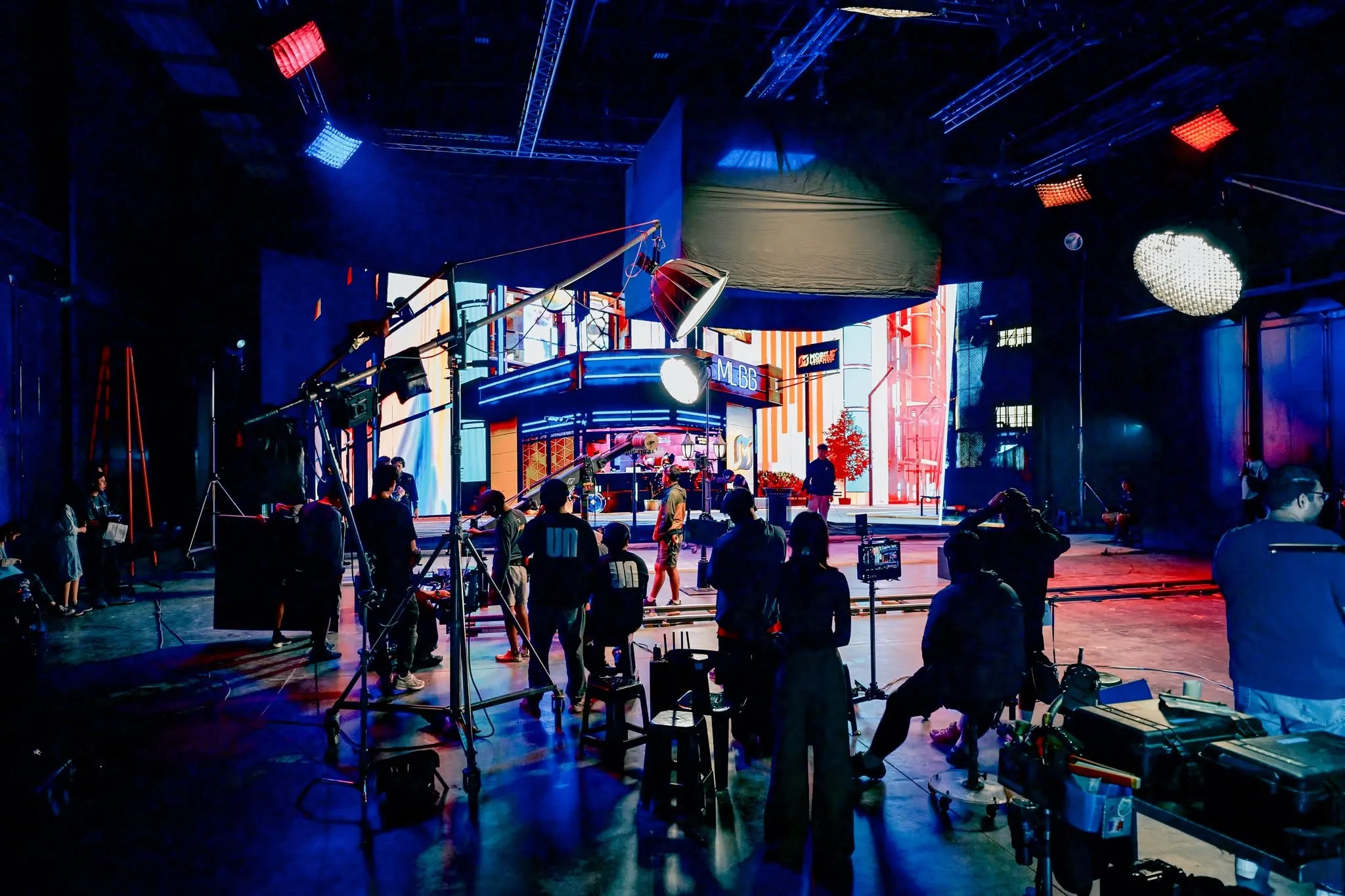 Crew, lighting and camera equipment in front of the neon-city LED environment for MLBB x Guyngid.