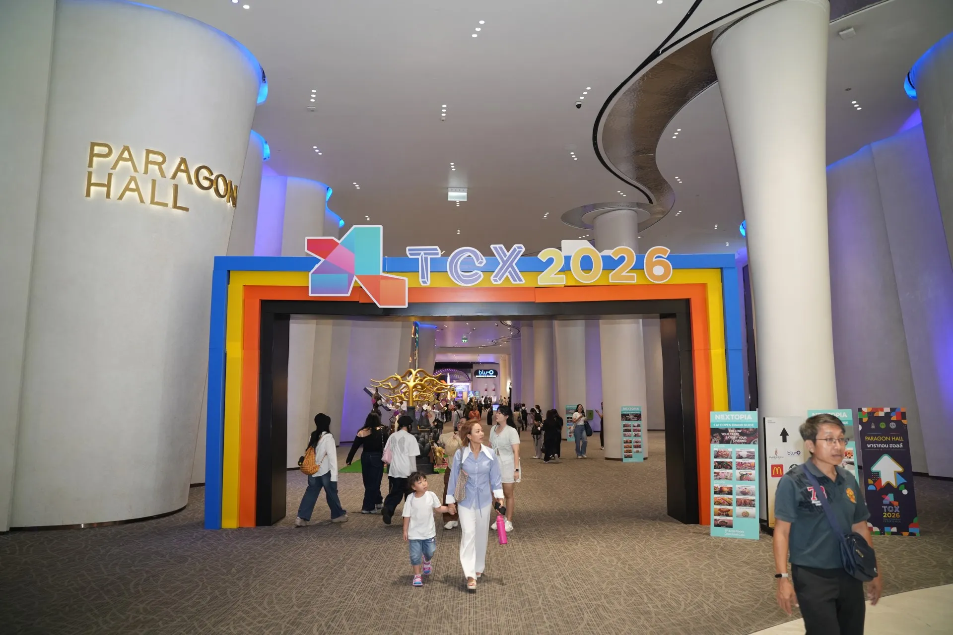 Visitors enter TCX 2026 through the colourful event arch at Paragon Hall.