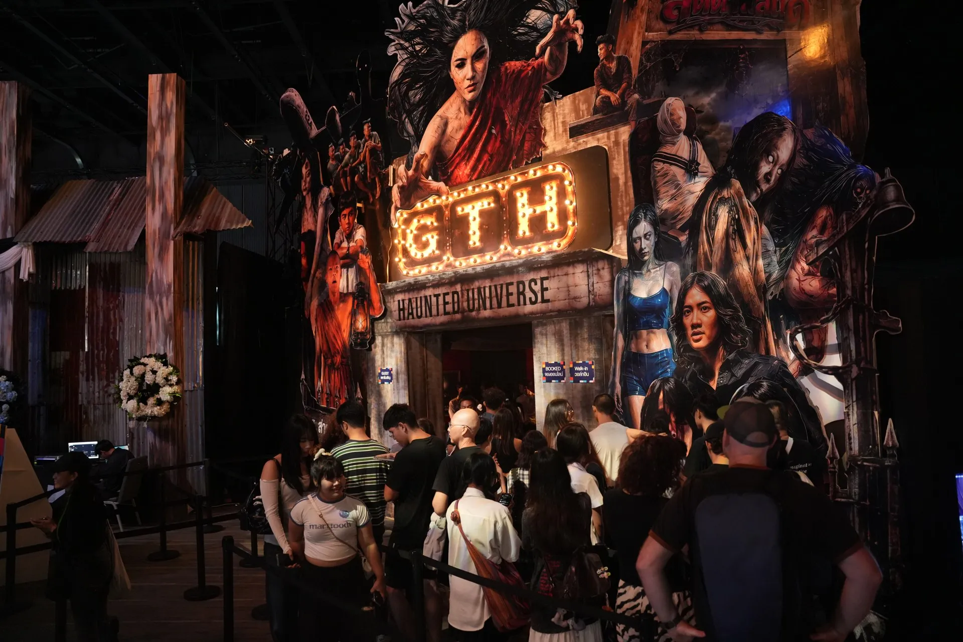 Visitors gather at the illuminated GTH attraction entrance at TCX 2026.