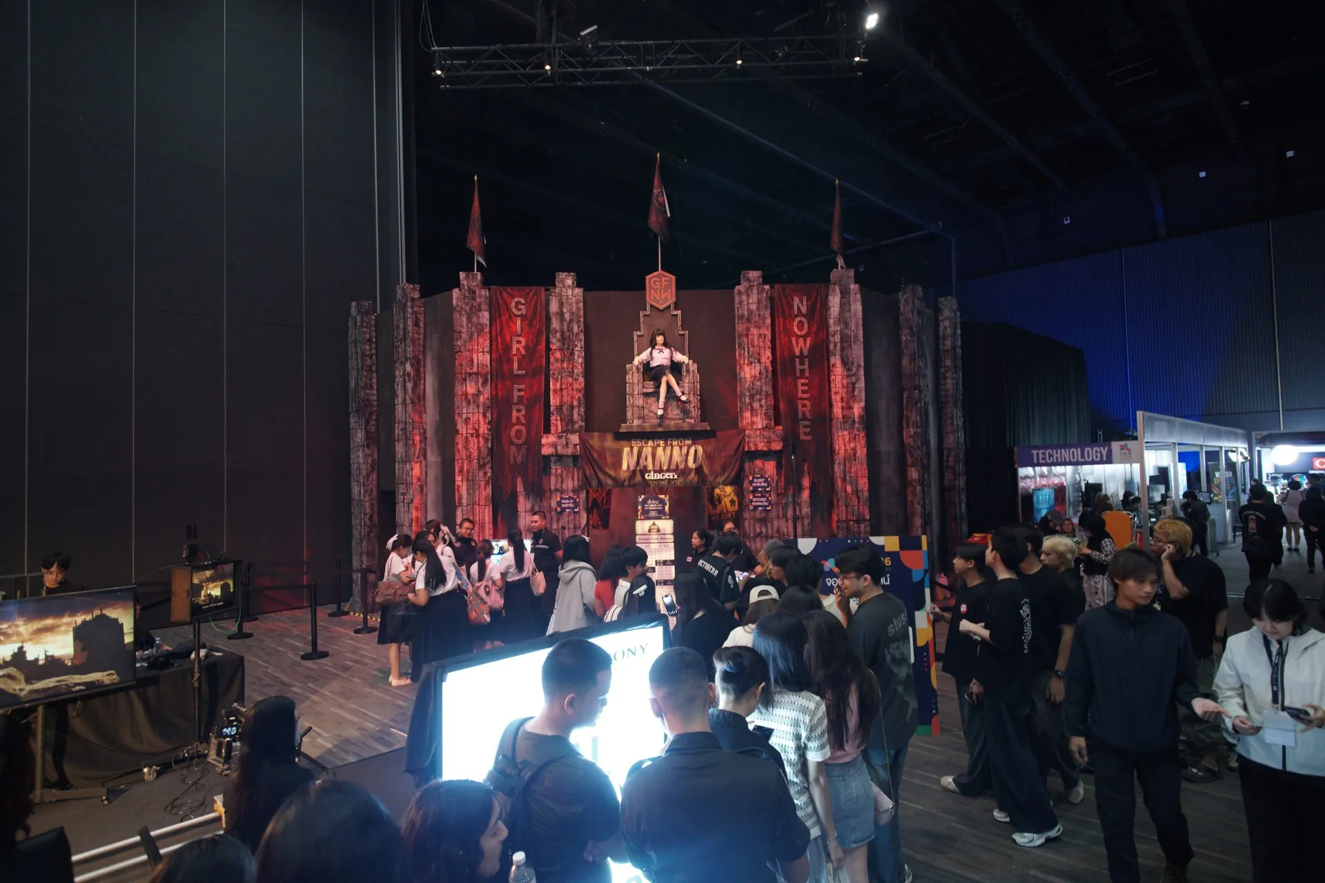 Visitors outside the red Escape from Nanno frontage at TCX 2026.