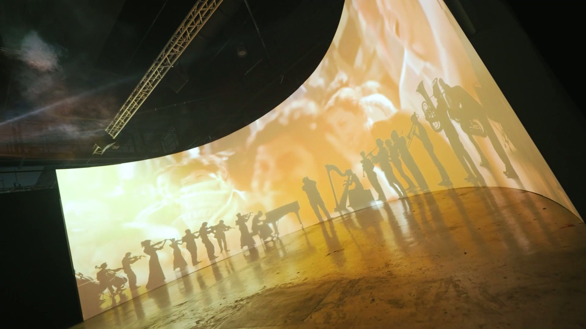 Curved projection space at TCX 2025, still from the final KAMELION project film.